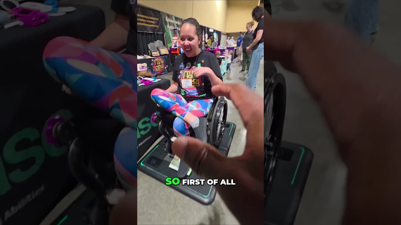 Wheelchair user reacting to Fold while trying the scale at an accessibility expo